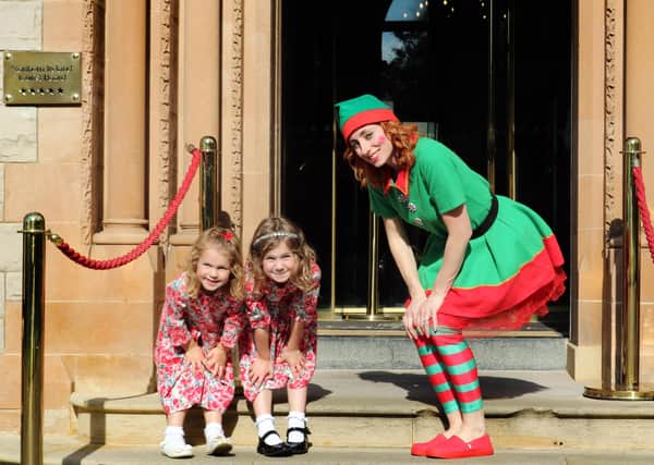 Ellie (age 4) and Eva Corbett (age 5) joined Elf Trisha Renner from Hastings Hotels to launch Polar Express