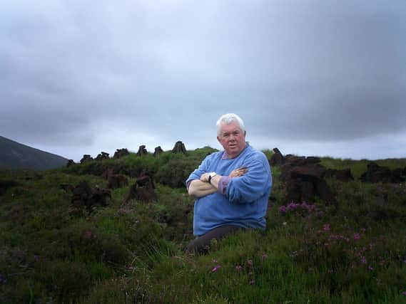 David Cook, the former Alliance Party politician, on a recent holiday at Muckish in Donegal having just spent an hour cutting turf
