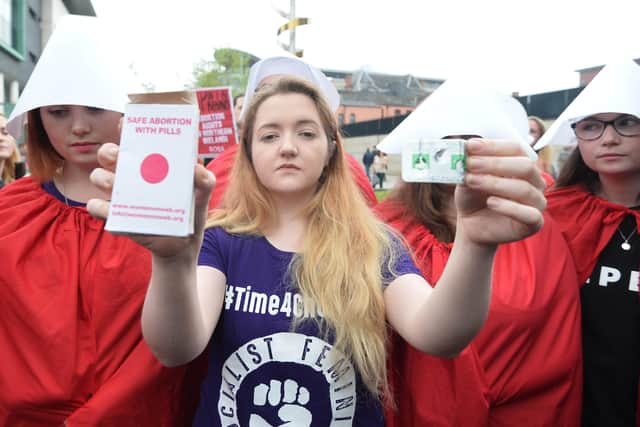 An abortion activist with pills in Belfast in 2018