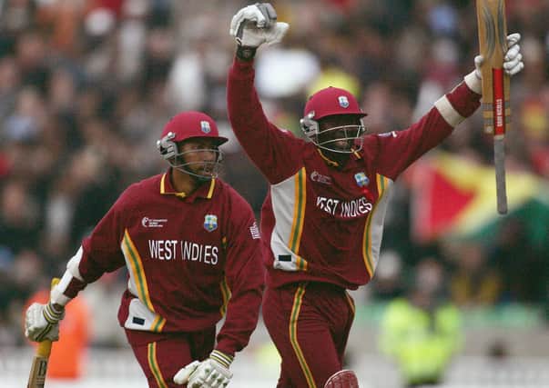 Ian Bradshaw and Courtney Brown of West Indies celebrate scoring the winning runs during the ICC Champions Trophy Final between England and the West Indies at the Brit Oval, on September 25, 2004 in London.