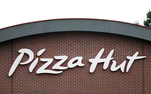 File photo dated 9/9/2020 of signage for a Pizza Hut Restaurant. Pizza Hut has named the 29 restaurants it will shut for good as part of a major restructuring with the expected loss of about 450 jobs.