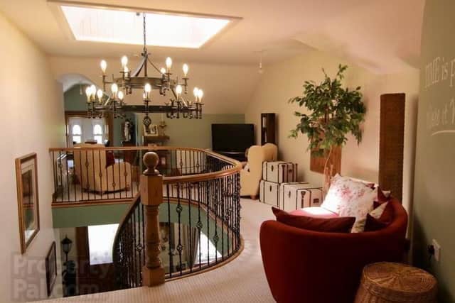 Gallery Landing with a feature curved wall and family area