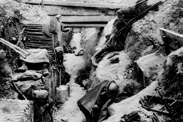 A British soldier keeping watch on 'No-Man's Land' as his comrades sleep in a captured German trench at Ovillers, near Albert, during the Battle of the Somme in the 1914-1918 First World War. Picture: PA Photo