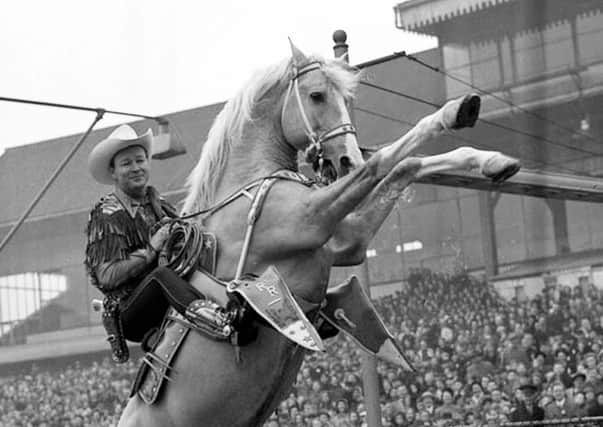 Cowby film star Roy Rogers rides his famous horse Trigger in this 1954 photo in London. He also visited Belfast that year, and other cities in the UK such as Liverpool and Glasgow, and he travelled to Dublin  (AP Photo/files)
