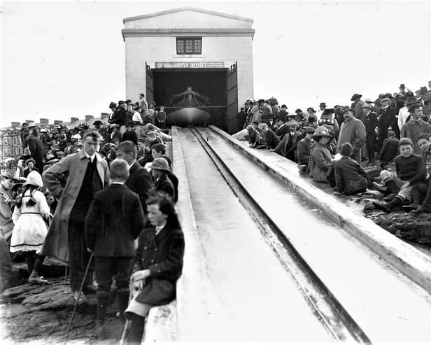 Townsfolk eagerly await practice launch of the Lifeboat Hopwood at the Boathouse and Slipway at Lansdowne. Circa 1912