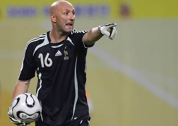 French goalkeeper Fabien Barthez gestures during the World Cup 2006 group G football game France  vs. South Korea, 18 June 2006 at Leipzig stadium.  (Photo:  PATRIK STOLLARZ/AFP via Getty Images).