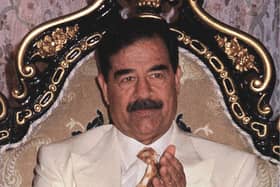 Iraqi President Saddam Hussein on his 61st birthday in 1998. AP Photo/INA, POOL, file
