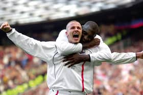 England's captain David Beckham (front) celebrates with team-mate Emile Heskey after scoring the equaliser from a free kick against Greece in the dying seconds of European Qualifying match at Old Trafford, Manchester in 2001.