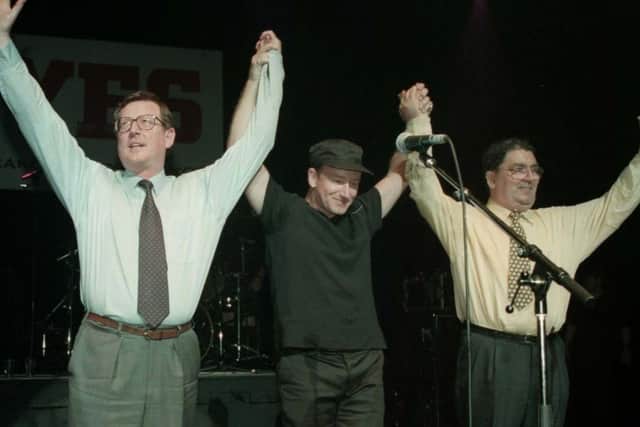 File picture dated 19.5.98 of Ulster Unionist leader David Trimble (left), U2 singer Bono, and SDLP leader John Hume on stage for the 'YES' concert at the Waterfront Hall in Belfast.     John Hume and Ulster's First Minister, David Trimble, who helped broker the historic Northern Ireland peace agreement, were today awarded the Nobel Peace Prize.  PA Picture by Brian Little/PA