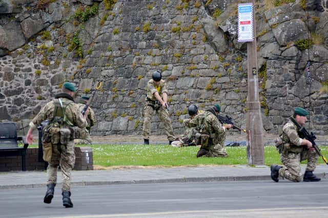 Soldiers stage a mock terrorist attack during a previous Armed Forces Day in Carrickfergus