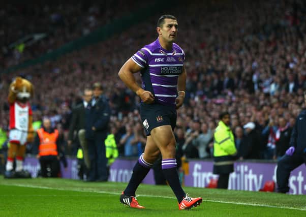 Wigan’s Ben Flower walks from the pitch after receiving a red card during the Super League Grand Final match between St Helens and Wigan Warriors in 2014.
