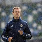Northern Ireland's Jonny Evans in a rain shower during Saturday's training session at the International Stadium at Windsor Park, ahead of the Euro Nations League game against Austria. Photo: William Cherry/Presseye.