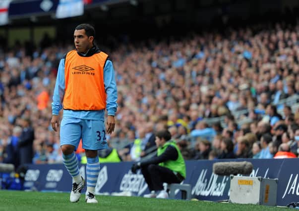 Carlos Tevez of Manchester City looks on from the sidelines during the Premier League match with Everton at the Etihad Stadium on September 24, 2011.  (Photo by Michael Regan/Getty Images).