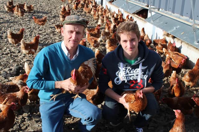Andrew Gilbert with son Ryan at Springmount Farm, the family business