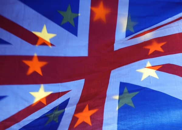 An EU and UK flag flying together