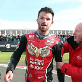 Mervyn Whyte congratulates Glenn Irwin after his maiden Superbike victory at the North West 200 in 2017.
