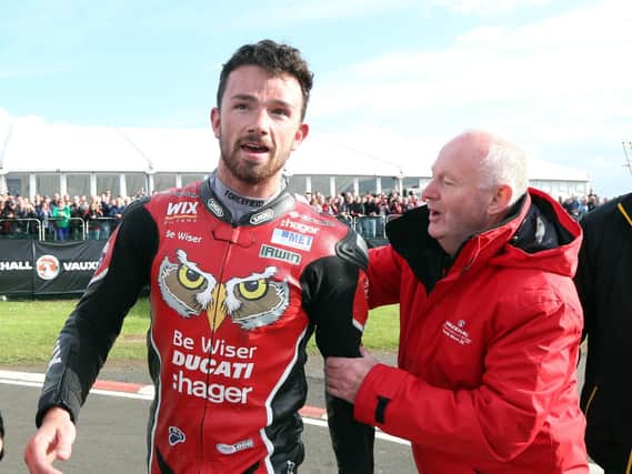 Mervyn Whyte congratulates Glenn Irwin after his maiden Superbike victory at the North West 200 in 2017.