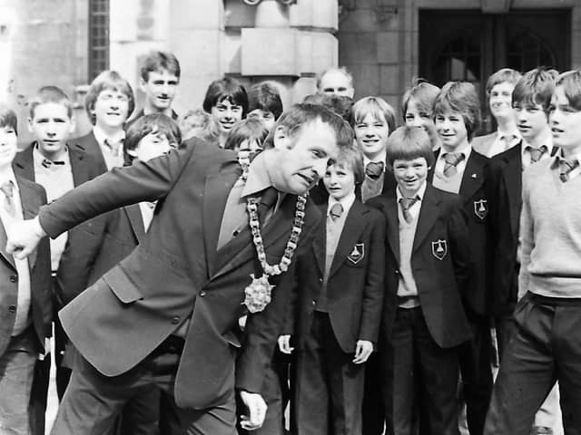 On the ball with pupils of Deramore School, Belfast, in September 1980 is Lord Mayor, Alderman John Carson, who had a game of headers with Graham McClure, 15, right, when the boys visited City Hall. The 23 pupils were leaving on September 11 for a two-week football tour in Duisberg, West Germany, where they were to play six matches against schools and football clubs. Picture: News Letter archives
