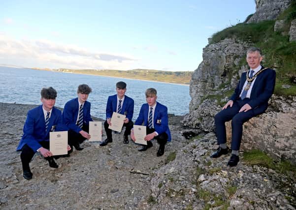 The Mayor of Causeway Coast and Glens Borough Council Alderman Mark Fielding pictured with the four teenagers involved in the rescue at Whitepark Bay earlier this year Michael Quinn, Shane McKenna, Josh Schnell and Niall Óg McGuigan.