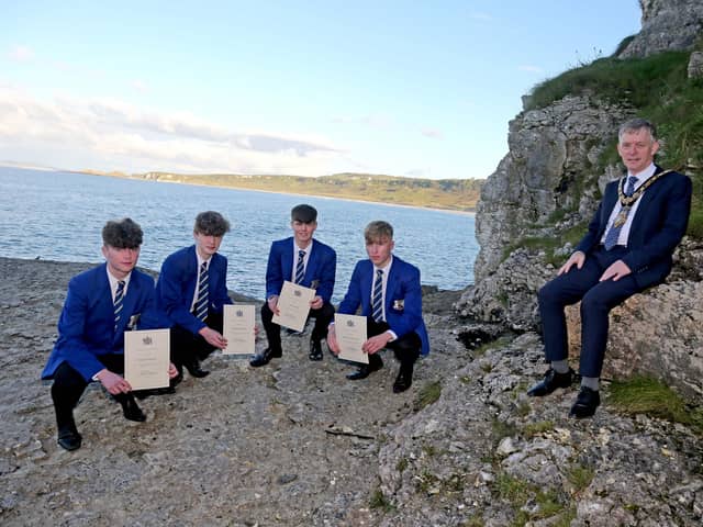 The Mayor of Causeway Coast and Glens Borough Council Alderman Mark Fielding pictured with the four teenagers involved in the rescue at Whitepark Bay earlier this year Michael Quinn, Shane McKenna, Josh Schnell and Niall Óg McGuigan.