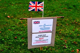 An anti-Irish Language Act sign at Stormont, placed there by unionist activists