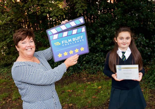Teacher Michelle McAlonan and pupil Georgia from Cliftonville Integrated Primary School prepare to take up the Film Buff Challenge Into Film’s free educational resource that can be worked on at school or at home. To access the Film Buff Challenge go to: wwwintofilm.org/filmbuff
