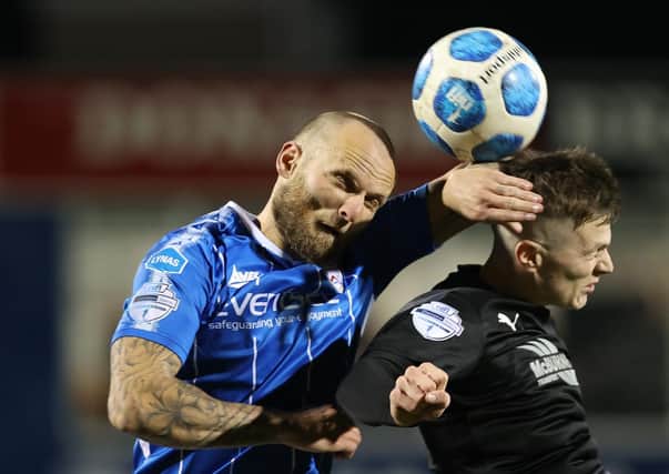 Coleriane's Gareth McConaghie (left) up against Ballymena United's Paul McElory. Pic by Pacemaker.