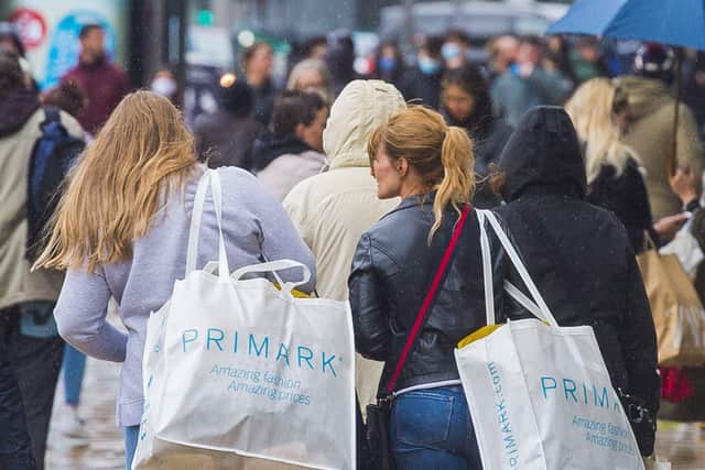 Shoppers walking home in heavy rainfall