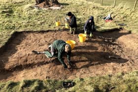 The Higgins family in Trench 2 excavating the cremelated fire trench