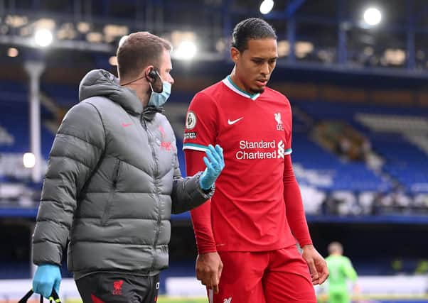 Liverpool's Virgil van Dijk was injured after a challenge by Everton goalkeeper Jordan Pickford during the Merseyside derby at Goodison Park.