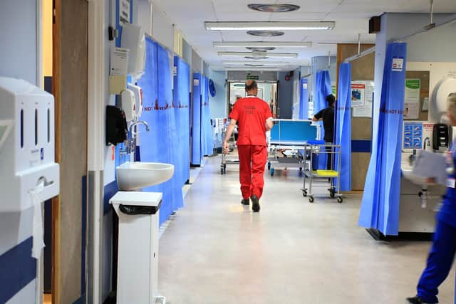 Hospitals are under increasing pressure as staff isolate due to Covid concerns