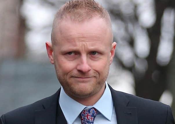 Jamie Bryson arrives Belfast Magistrates Court for an earlier hearing