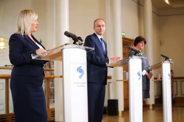 Micheal Martin flanked by Michelle O'Neill and Arlene Foster after a meeting of the North-South Ministerial Council at Dublin Castle, July 31