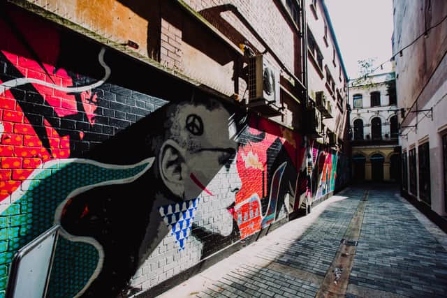 A mural in Crown Entry by artist ADW