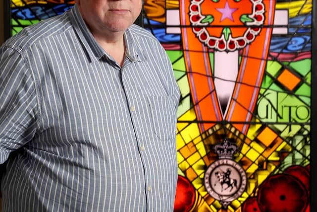 The Rev Mervyn Gibson pictured at the Order's stained glass memorial to Orangemen murdered during the Troubles