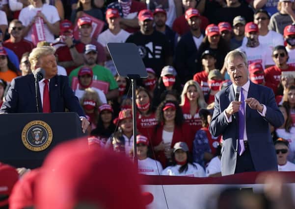 President Donald Trump on stage with Nigel Farage, right, former Brexit Party leader, at a Trump rally in Arizona on Wednesday. Many Brexiteers and unionists will understand the tribal loyalty that many Americans feel to Mr Trump, given that he was a rare supporter of Brexit and now that Joe Biden is echoing Irish nationalist grievances against Britain (AP Photo/Ross D. Franklin)