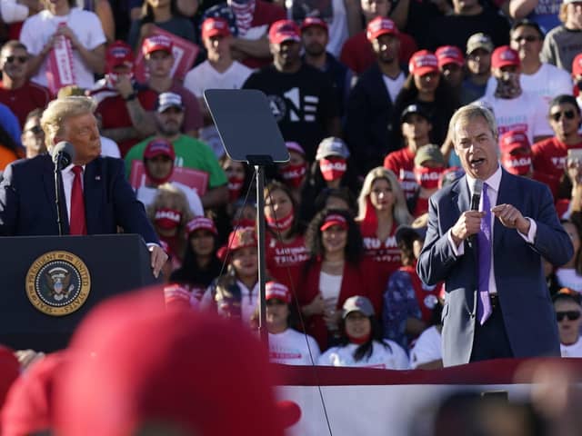 President Donald Trump on stage with Nigel Farage, right, former Brexit Party leader, at a Trump rally in Arizona on Wednesday. Many Brexiteers and unionists will understand the tribal loyalty that many Americans feel to Mr Trump, given that he was a rare supporter of Brexit and now that Joe Biden is echoing Irish nationalist grievances against Britain (AP Photo/Ross D. Franklin)