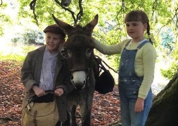 Young Actors Jude Hill and Savanna Burney Keatings with Denis the Donkey