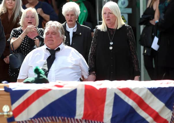 The parents of Brett Savage, Noel and Dolores, at their son's coffin during his funeral in Newtownards. The 32 year-old-former Royal Irish Regiment soldier died by suicide after suffering from PTSD following service in Afghanistan. 
PICTURE BY STEPHEN DAVISON