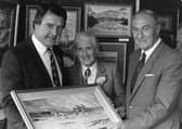 Admiring a painting by Lady Kinahan at the Collegians Art Show in October 1987 are Peter Jones, president of the club, artist Ida Teuton and Willoughby Wilson, president of the Ulster Branch of the Irish Rugby Football Union. Picture: News Letter archives