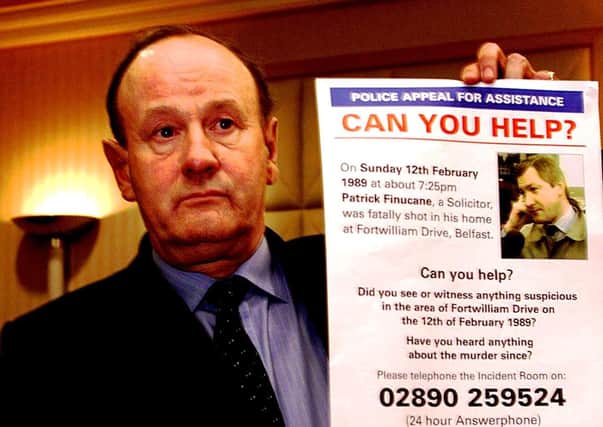 Ex-police chief of The Met John Stevens with an appeal poster, 2003
