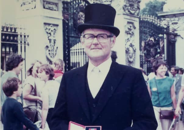 The civil servant Sinclair Duncan photographed outside Buckingham Palace after being honoured by the Queen with an ISO in 1984