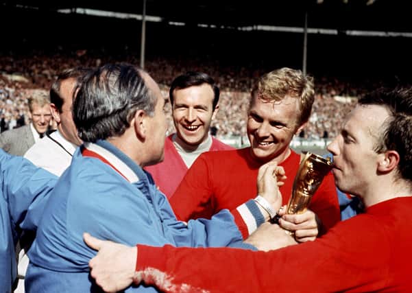 Nobby Stiles kisses the World Cup trophy in 1966. Pic by PA.