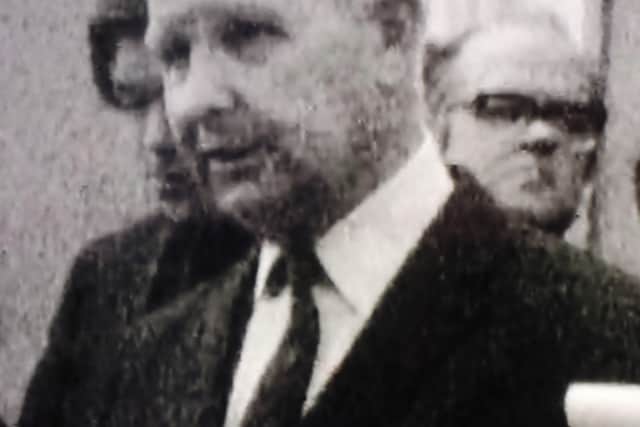 Sinclair Duncan’s role was behind the scenes but here he is seen in the background of a 1972 BBC clip of Brian Faulkner, who later became his boss