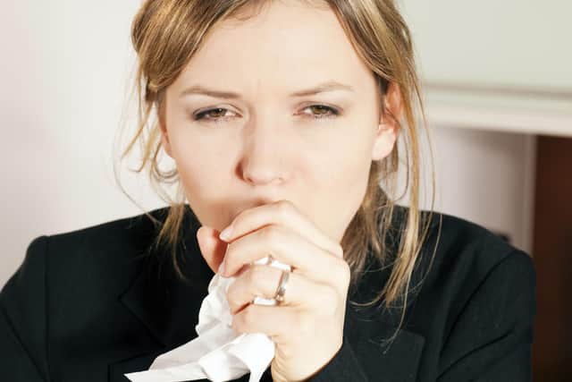 A Generic Photo of a woman coughing