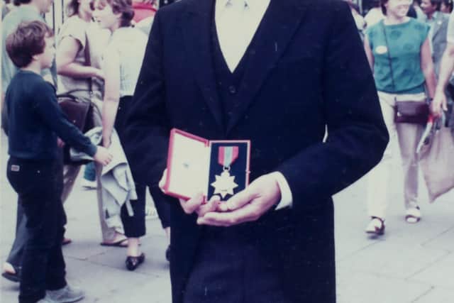 Sinclair Duncan photographed outside Buckingham Palace in 1984 after being honoured by the Queen with the Imperial Service Order