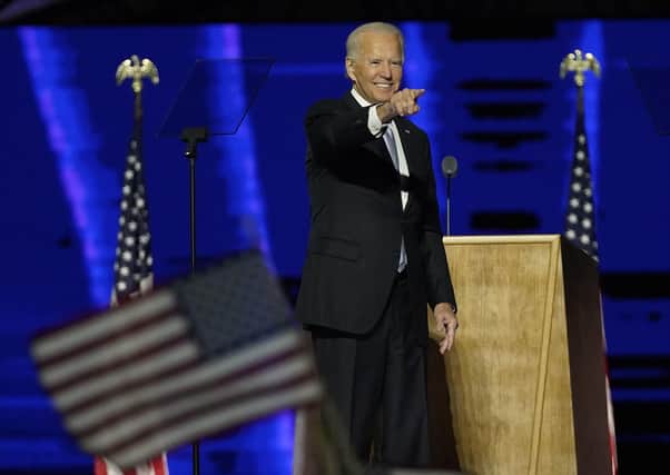 Joe Biden gestures on stage after speaking at his victory rally on Saturday, Nov. 7, 2020, in Wilmington, Delaware (AP Photo/Andrew Harnik, Pool)