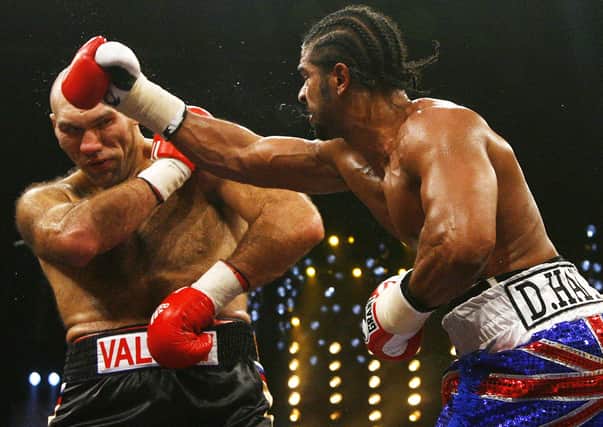 Russian WBA heavyweight champion Nikolai Valuev (L) vies with British challenger David Haye during their WBA heavyweight boxing world champion match in the southern German city of Nuremberg on November 7, 2009. Haye claimed the WBA heavyweight title on with a shock majority decision win against Valuev over 12 rounds.  AFP PHOTO DDP / TIMM SCHAMBERGER   GERMANY OUT (Photo credit should read TIMM SCHAMBERGER/DDP/AFP via Getty Images)