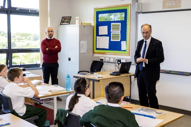 Education Minister Peter Weir talking with pupils at St Joesph's Primary School Carryduff in September.