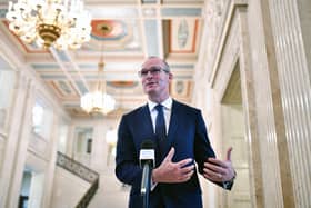 Simon Coveney, who wishes to see unification in his political lifetime, seen at Stormont last years. The shared island unit, he observes, is "very engaged in the politics of Northern Ireland"